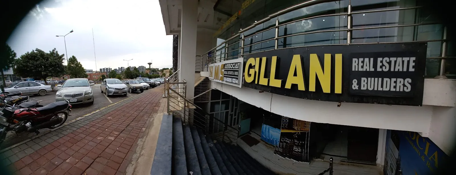 The Gillani Real Estate & Builders office front in Ahsan Arcade, Bahria Town Phase 8